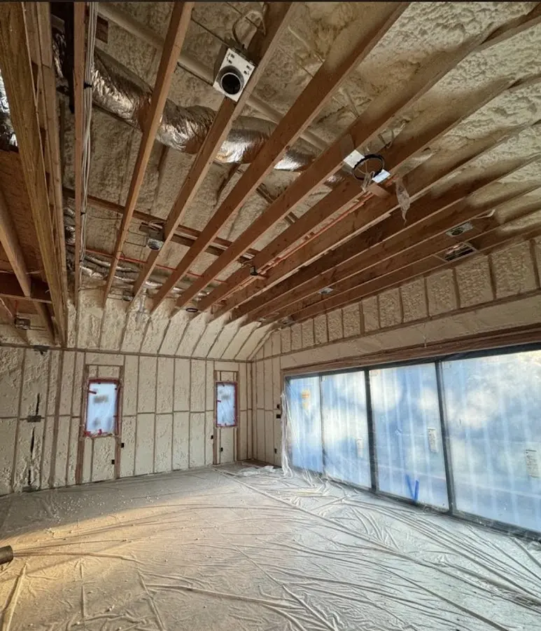 Interior walls and ceiling insulated with spray foam during new construction in East Hanover